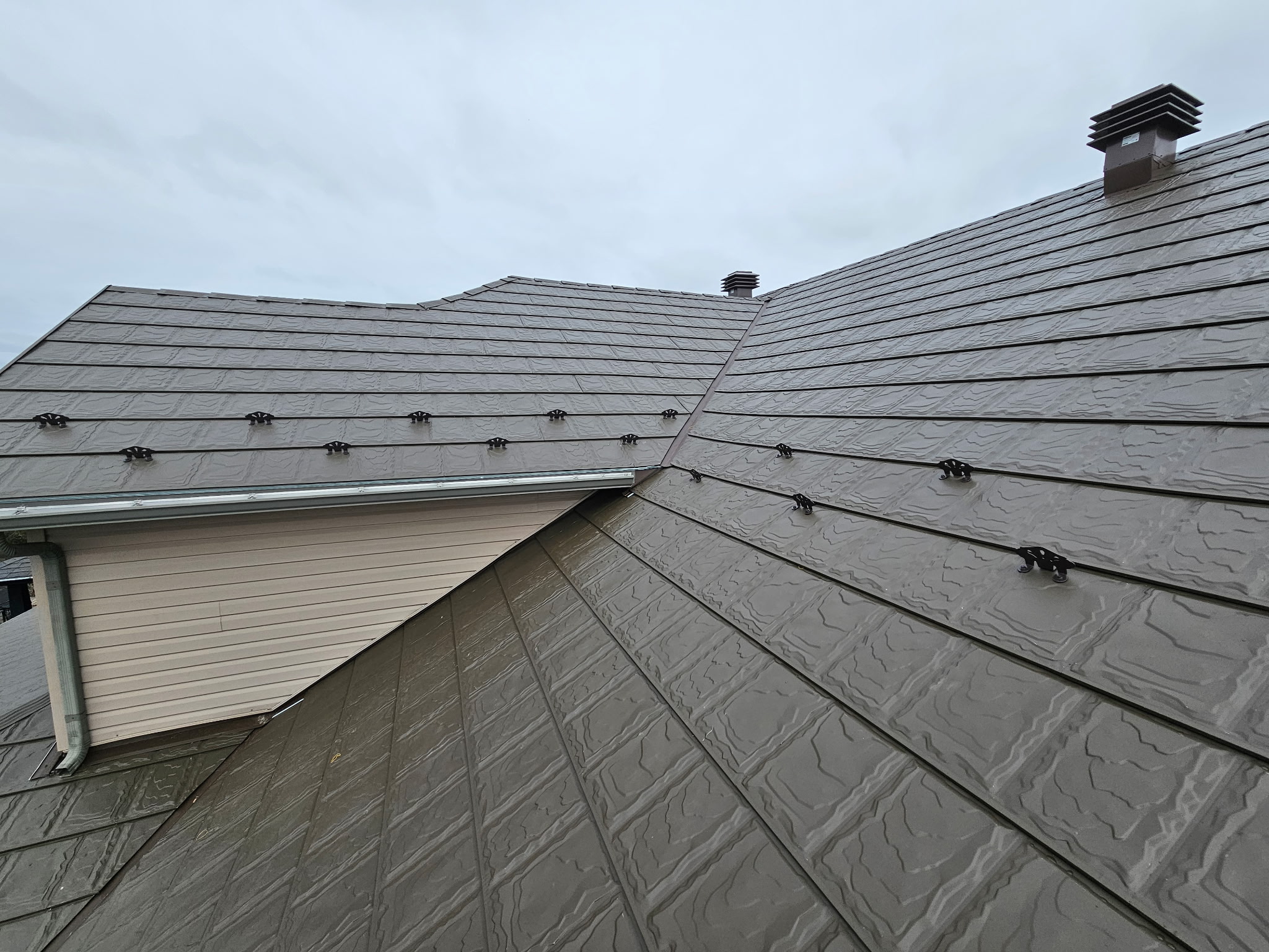 Metstar steel slate panels installed around roof valleys, vents and snow retention
