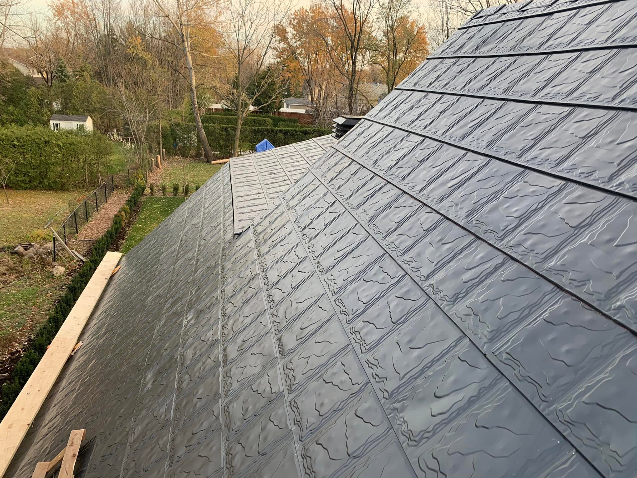 Close view of installed Metstar crinkle-finish metal roofing panels
