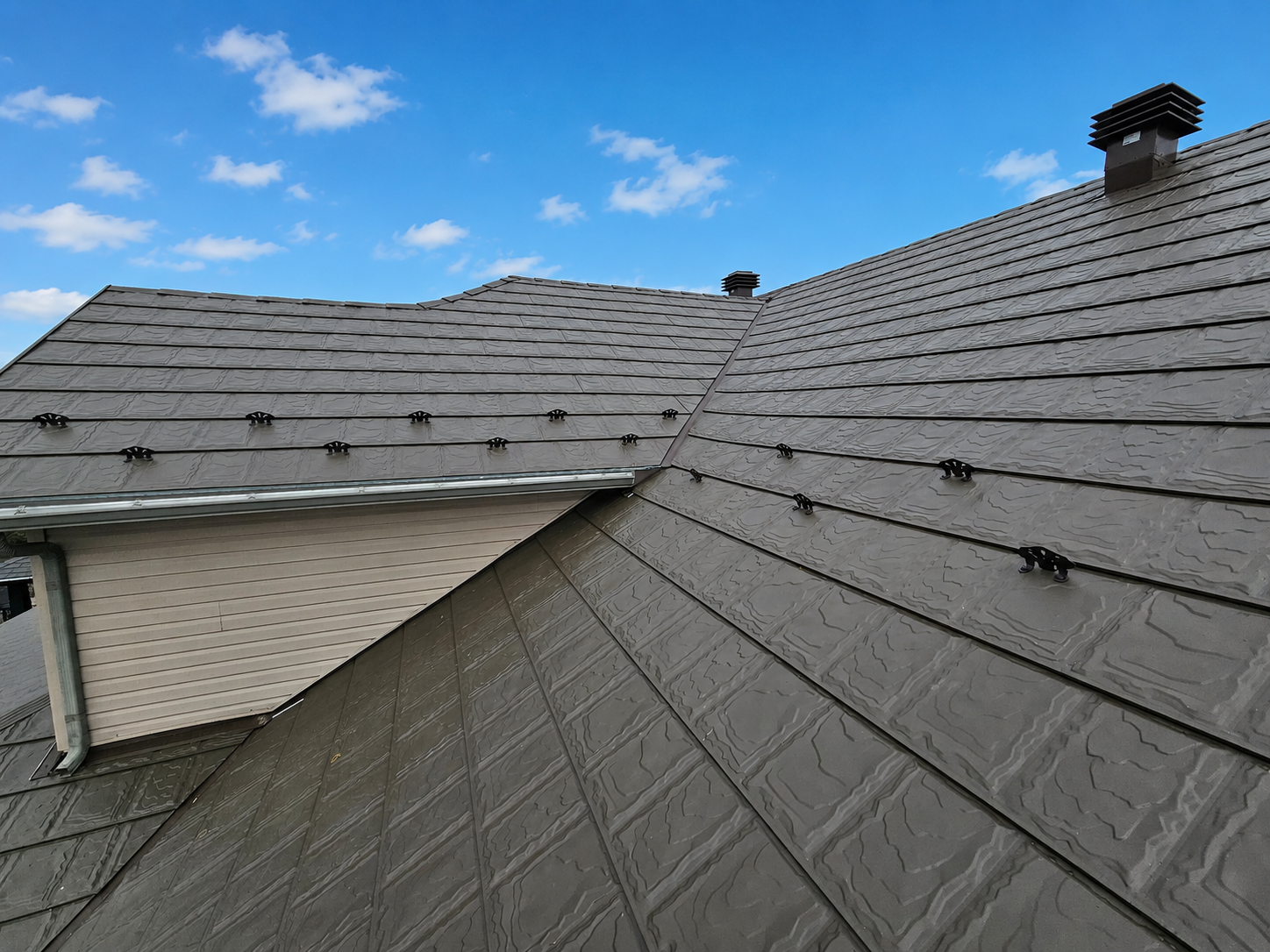 Integrated solar panels with metal roofing