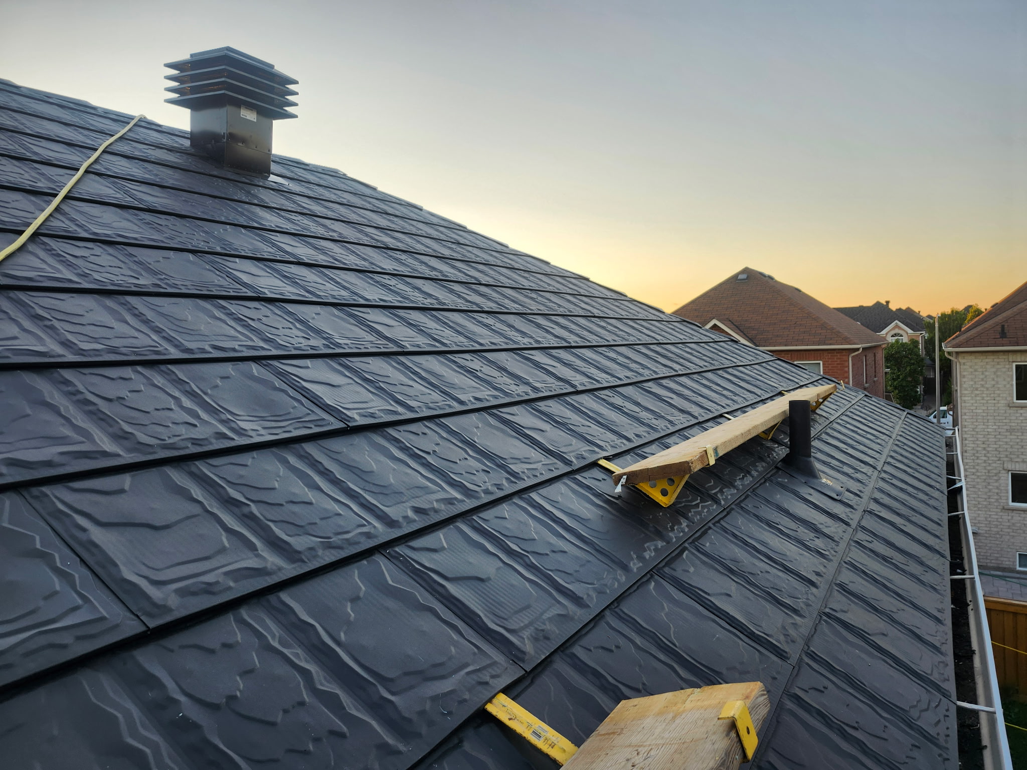 Metstar textured steel slate roof during professional installation