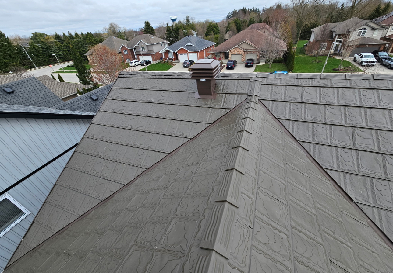 Completed Metstar slate-profile metal roof in a brown textured finish